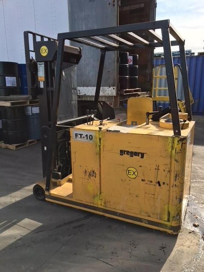 Side view of refurbished 2008 Gregory RC4EX EX rated explosion‑proof dockstocker showing chassis, mast, and CSA certification decal during Brampton deployment.