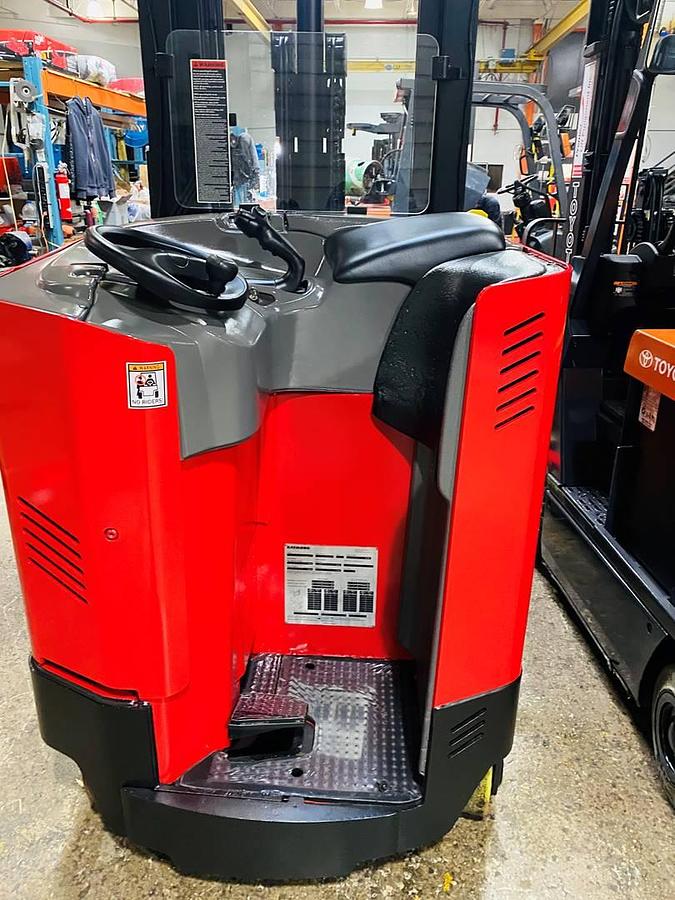 Operator compartment view showing stand-up controls and ergonomic handle