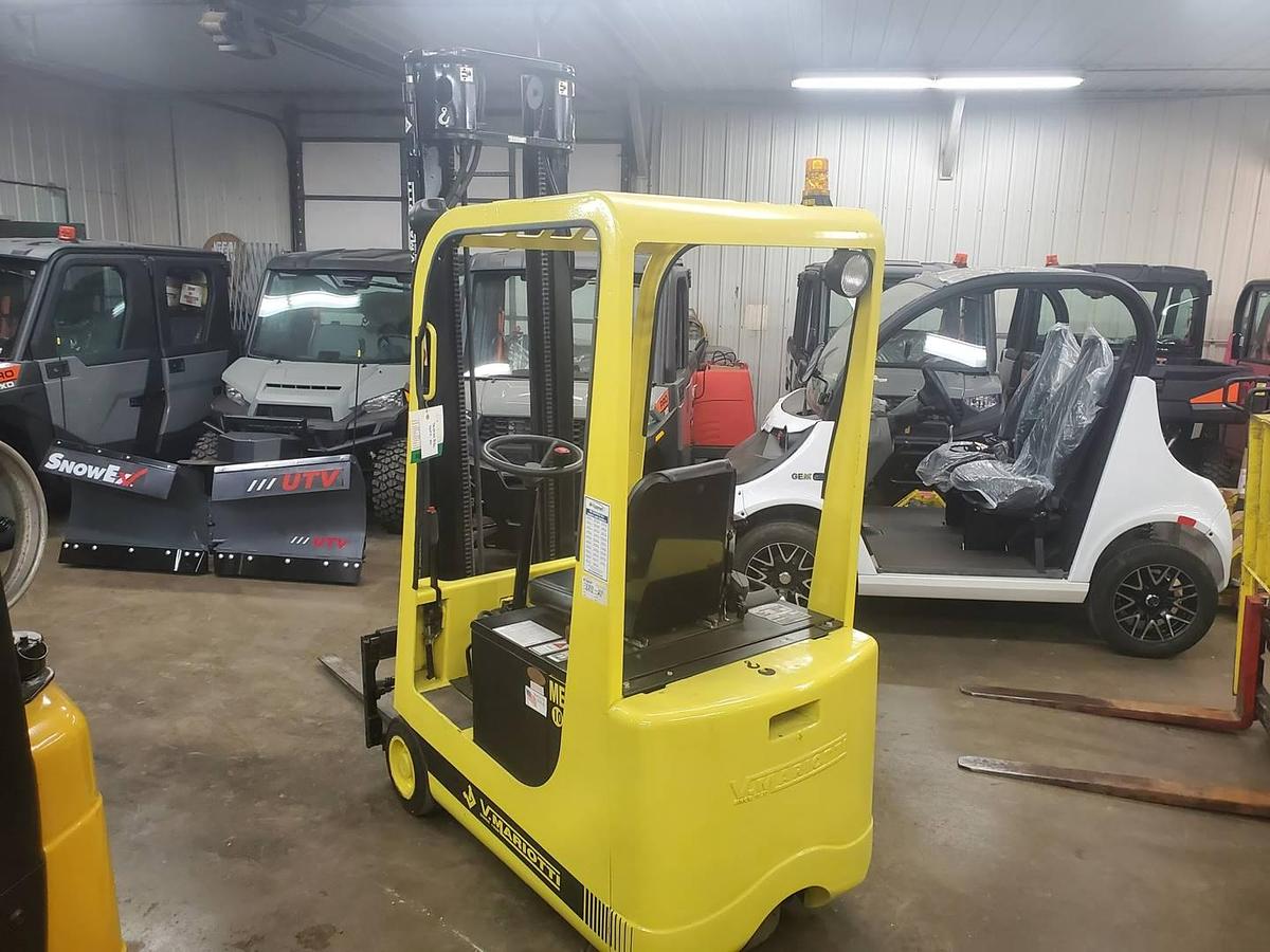 Rear side view of refurbished 2008 Mariotti ME10 3‑wheel electric forklift showing rear chassis, battery compartment, and CSA certification decal during Brampton deployment.