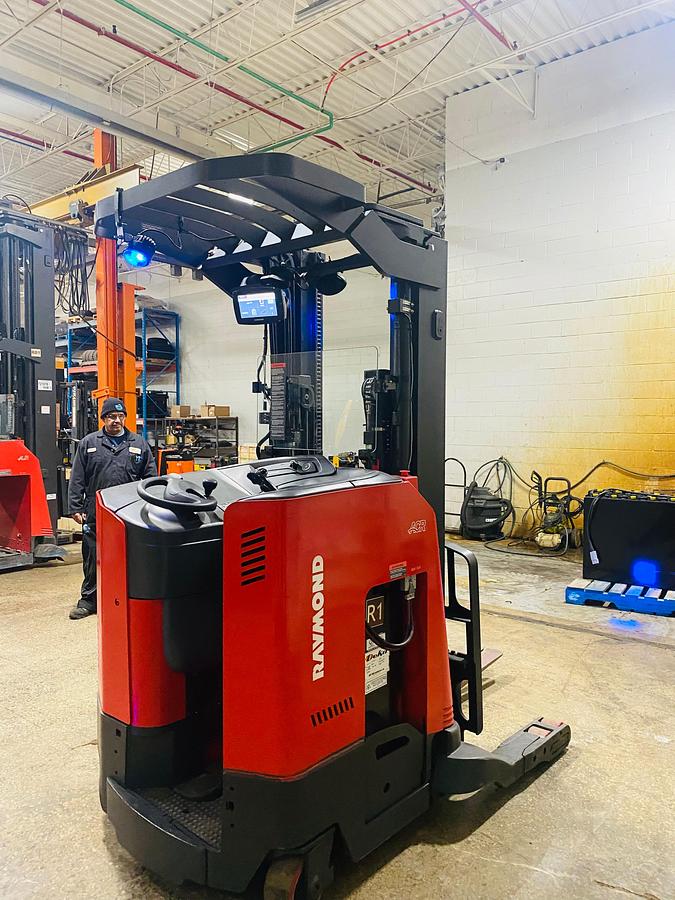 ear view showing counterweight and mounted safety lighting