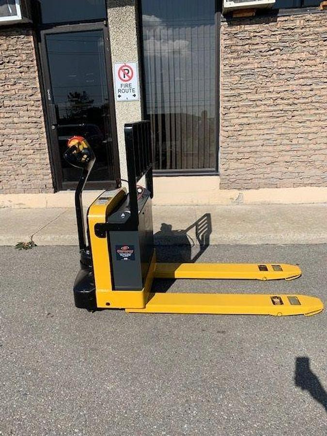 Side view of refurbished 2010 Yale MPB040 electric walkie pallet jack showing 27" x 48" forks, CSA decal, and compact chassis during Ontario deployment
