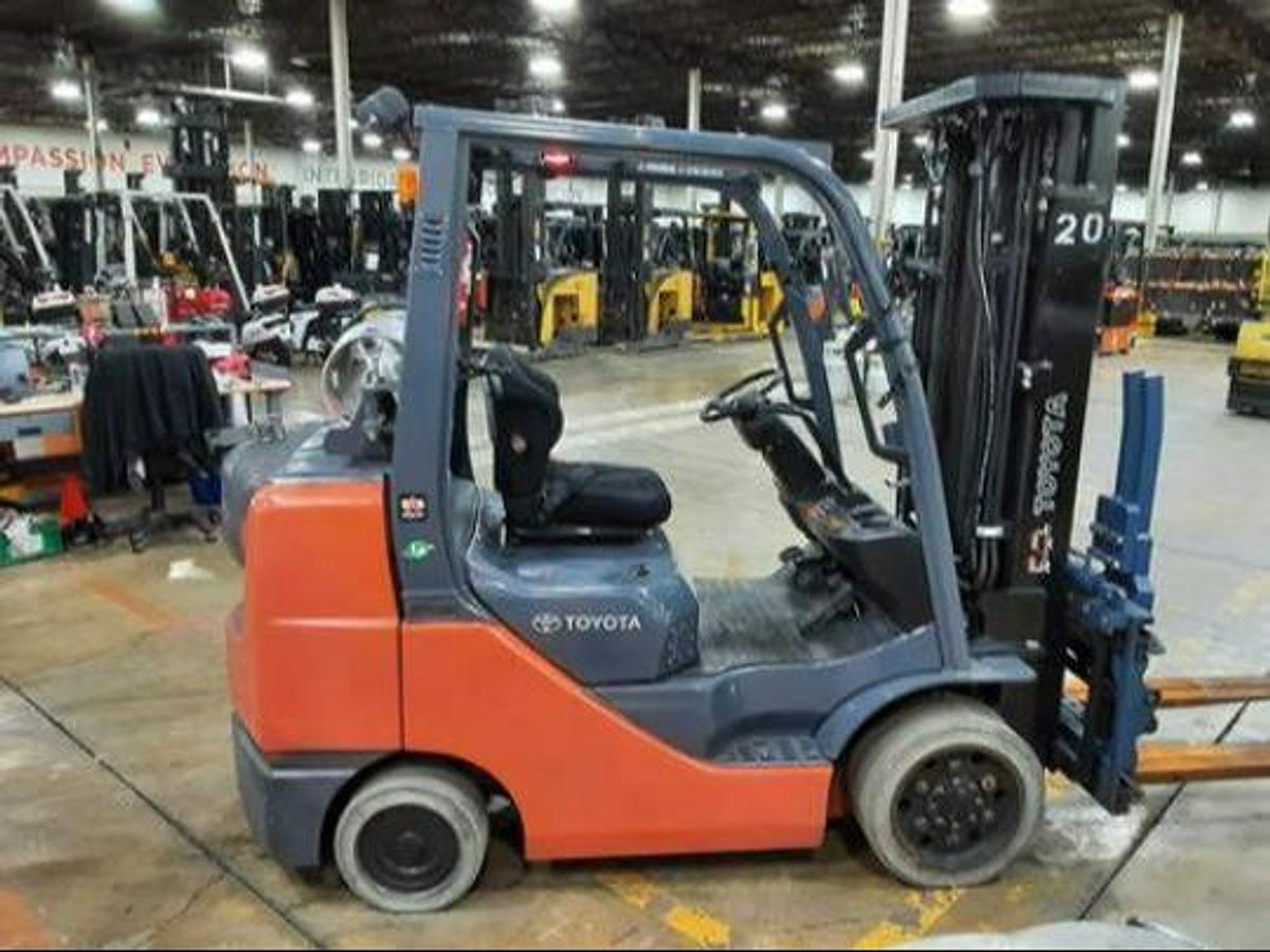 side view of refurbished 2017 Toyota 8FGCU32 LP gas forklift showing operator cab, rear chassis, and CSA decal during Brampton deployment
