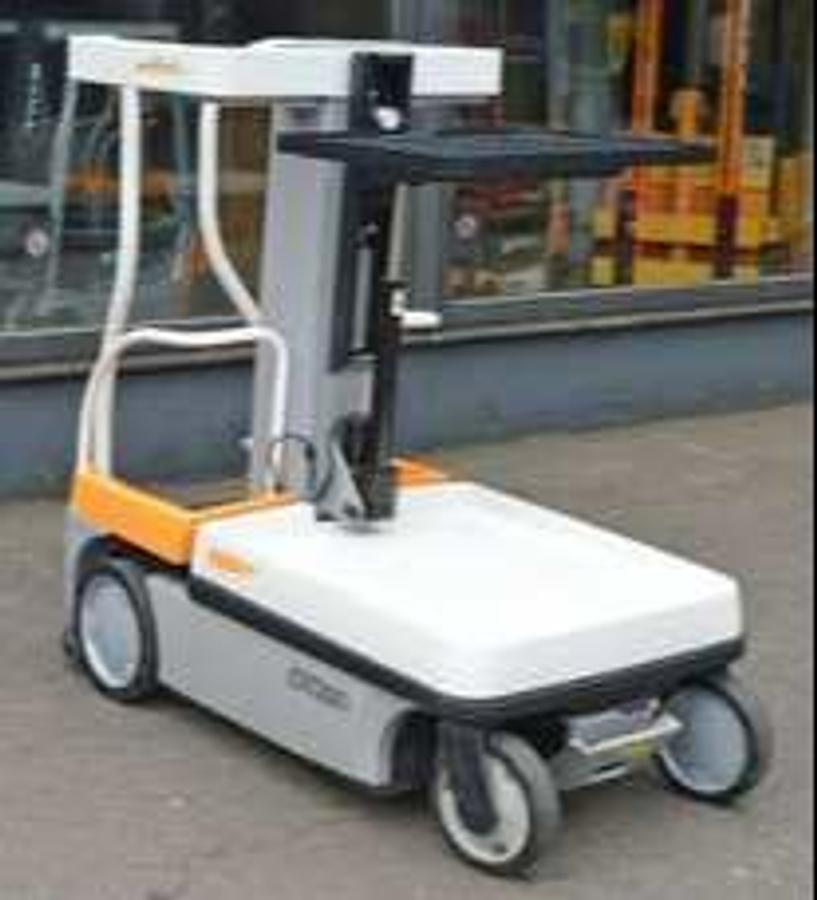 Front‑angle view of a 2010 Crown WAV50‑118 work assist vehicle showing operator platform, vertical mast, and narrow‑aisle maneuverability