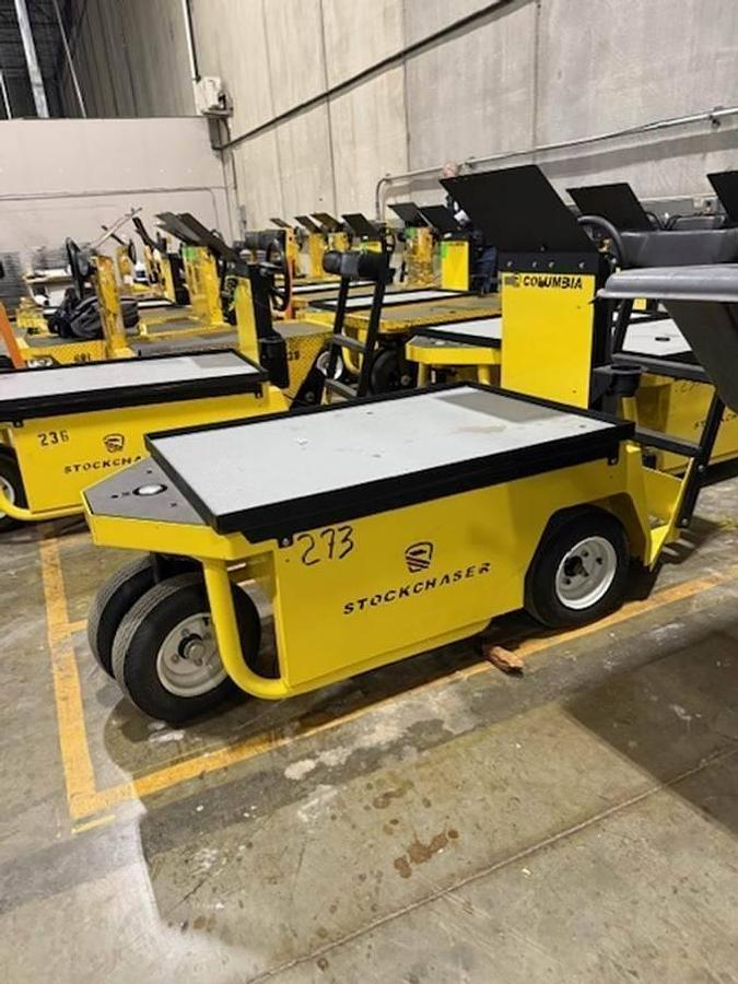 Columbia Stock Chaser-100 – front angle view – cargo deck, steering column, rider seat – electric burden carrier – Brampton ON