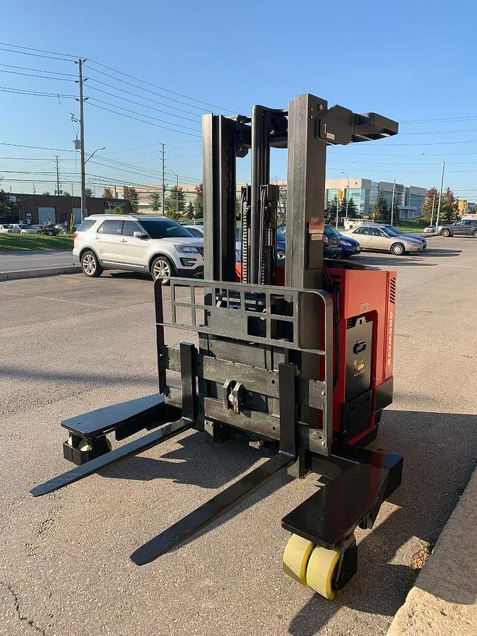 Refurbished 1998 Raymond EASI 4D-R45TT electric reach truck with 187" triple mast and CSA decals shown at front side angle during Brampton deployment