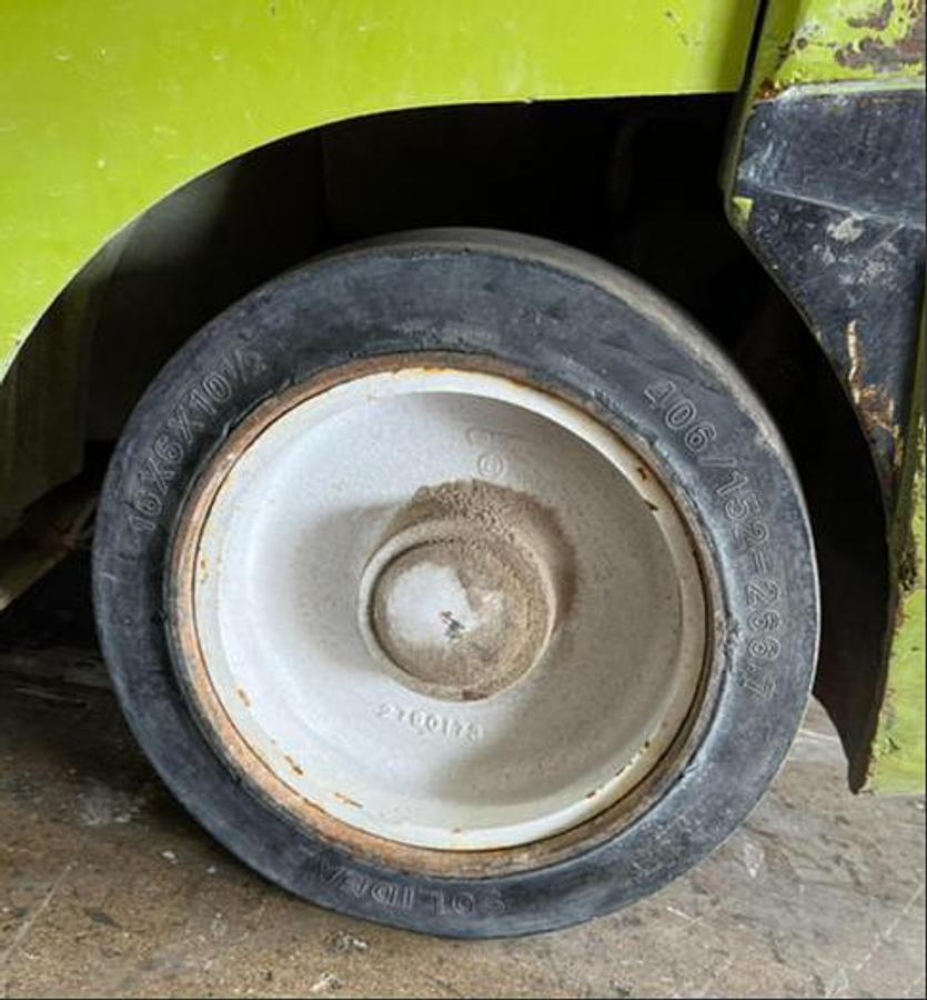 Left steer tire of Budget Clark CGC25 LPG cushion forklift, older non‑CSA unit.