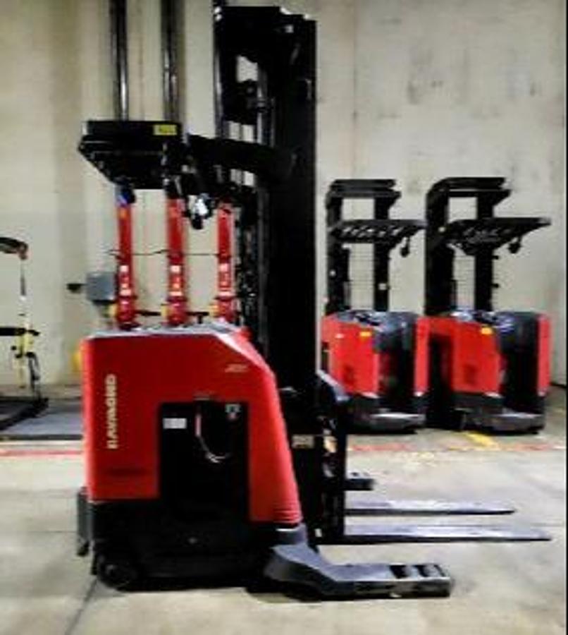 Side view of Raymond 750-R45TT electric reach truck – fourth CSA-certified 4,500 lb single-reach forklift in matched fleet with 268” triple mast and side shift, staged in Brampton ON – Premier Lift Equipment