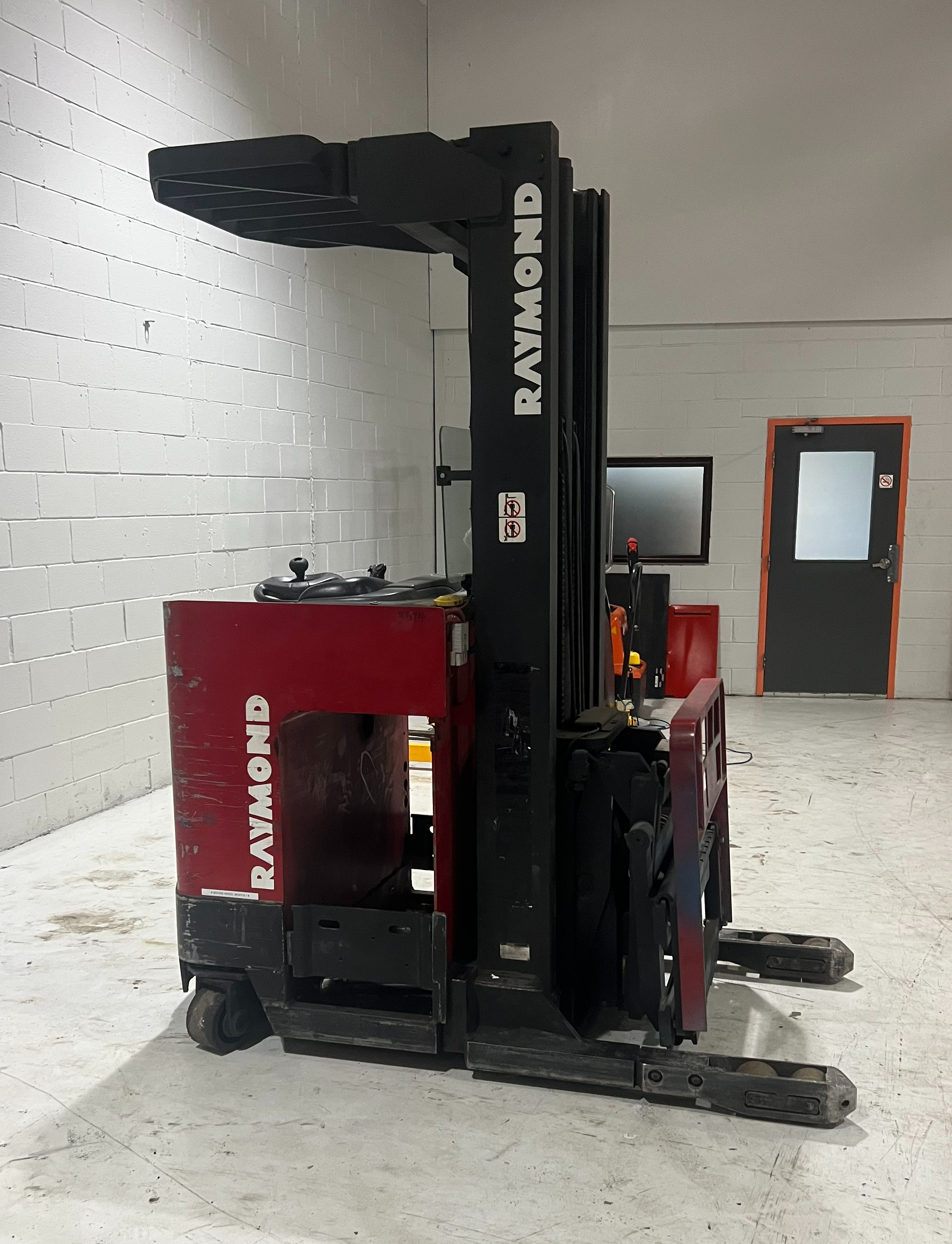 Side View: Budget Raymond reach truck with cushion tires and side shift