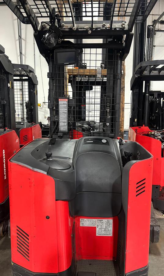 Rear view of the Raymond 731‑4D‑R45TT electric forklift showing counterweight, safety lighting, and stand‑up operator entry.
