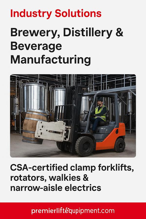 CSA‑certified forklift with rotator attachment unloading barrels in a distillery production zone with stainless‑steel tanks and batch‑processing equipment.