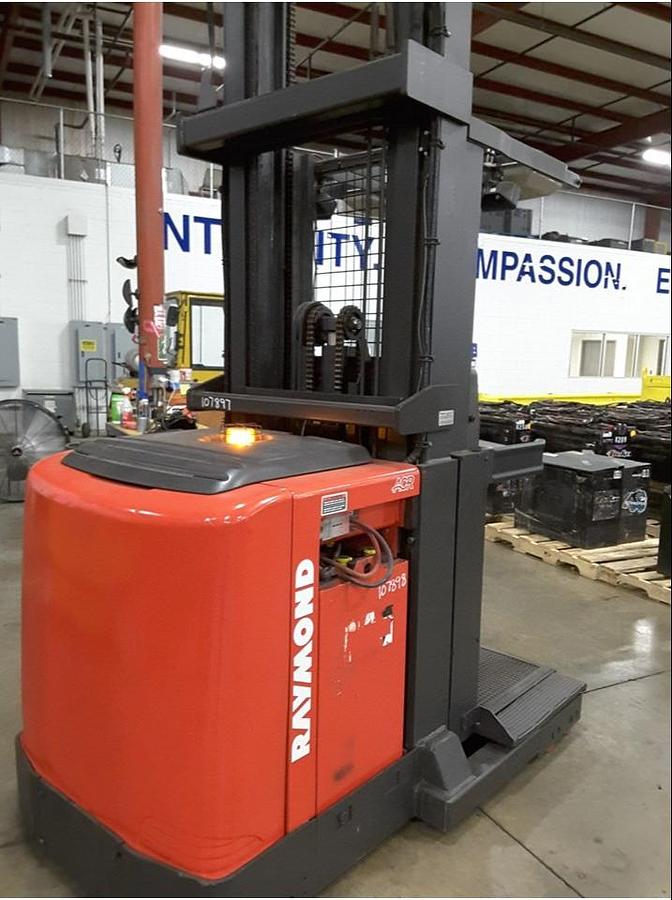 Rear view of refurbished 2011 Raymond 560-OPC30TT electric order picker showing counterweight, battery door, and rear chassis panel during Toronto deployment