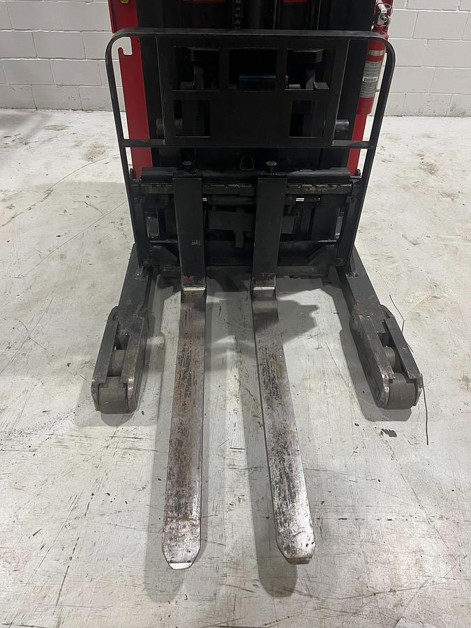 Close‑up of forks and straddle legs on Raymond EASIR40TT Budget reach truck.