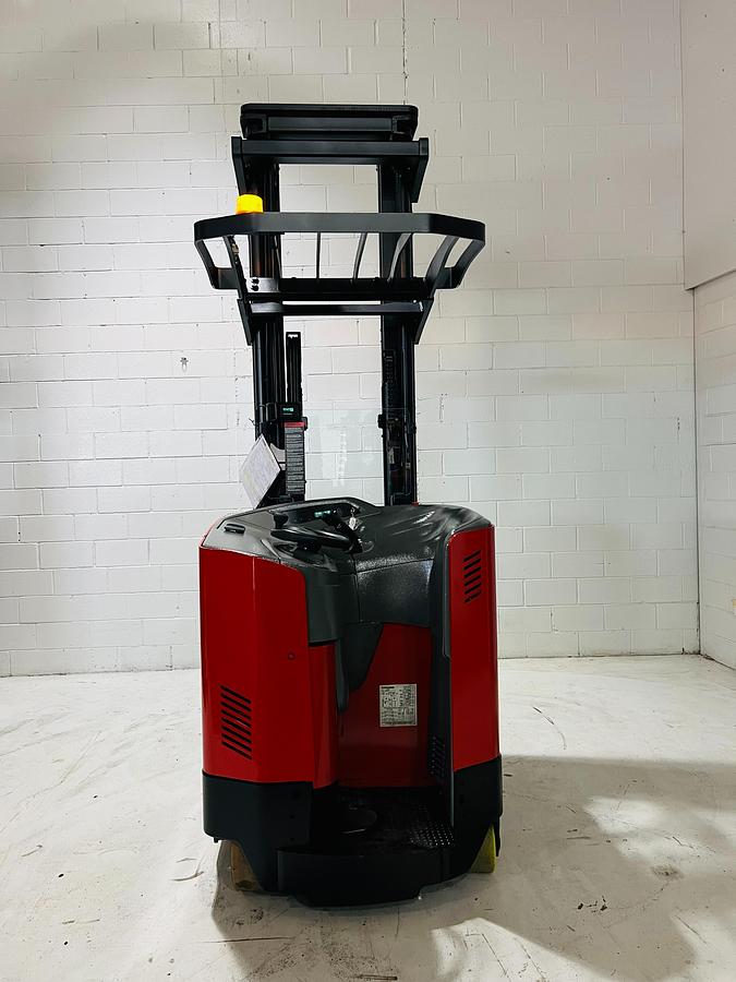 Rear side angle of Raymond 750DR32TT deep-reach forklift showing counterweight, rear wheels, and CSA certification during warehouse deployment