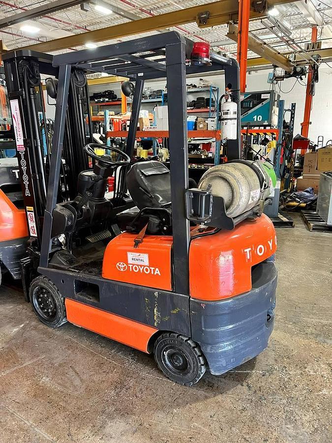 Opposite side view of refurbished 2000 Toyota 42-6FGCU15 LP gas forklift showing operator cab, rear chassis, and CSA decal during Brampton deployment