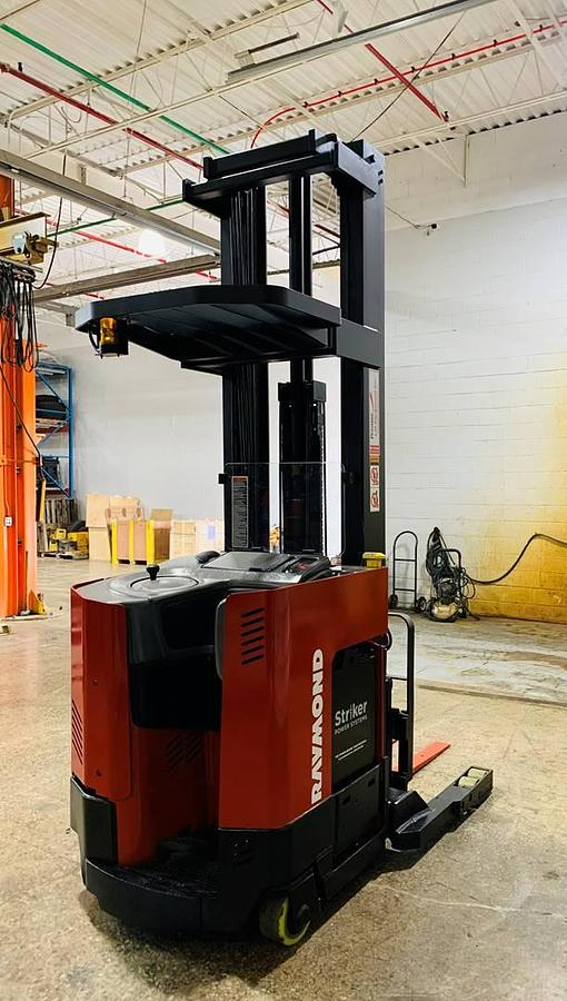 Rear view of refurbished 2000 Raymond EASIR40TT electric reach truck showing counterweight, battery door, and rear chassis panel in Mississauga inventory