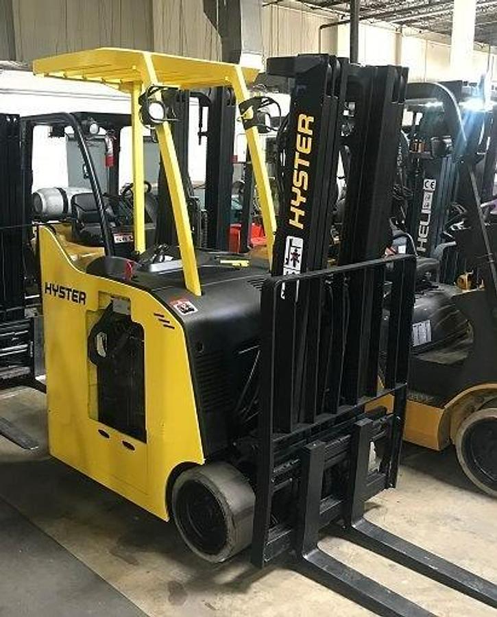 Side view of refurbished 2006 Hyster E35HSD stand‑up counterbalance forklift showing 3‑stage mast, side shift, cushion tires, and CSA certification decal during Ontario deployment.
