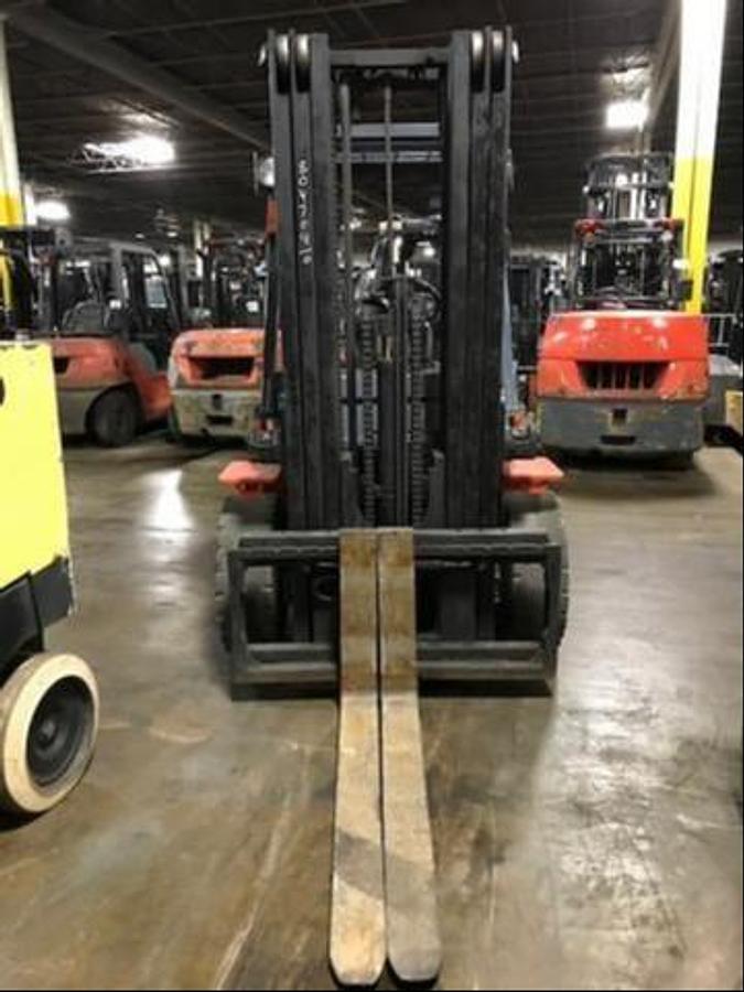 Front view of refurbished 2008 Toyota 7FGU35 LP gas forklift showing mast, carriage, and solid pneumatic tires during Brampton deployment