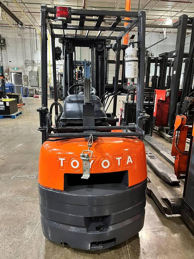 Rear view of Toyota 42-6FGCU15 propane cushion forklift showing counterweight, propane tank mount, and CSA-certified frame – unit staged in Brampton ON