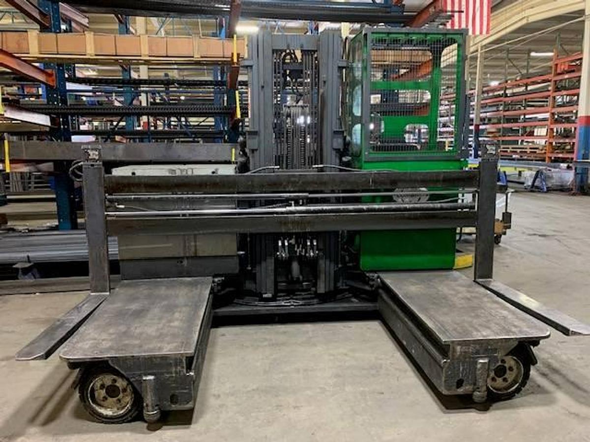 Front view of refurbished 2013 Combilift C6000EST electric multi‑directional forklift showing 48" forks, 48" platform, 216" mast, solid pneumatic tires, and CSA certification decal during Ontario deployment.