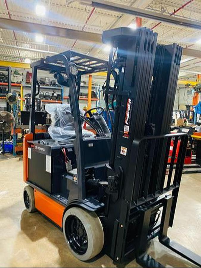 Front angle view of 2019 Toyota 8FBCU20 electric forklift – CSA-certified 4,000 lb chassis with 241” quad mast, 42” forks, load backrest, and clamp-ready 4-way hydraulics shown reconditioned with used battery option and new 48V battery upgrade available in Brampton ON – Premier Lift Equipment