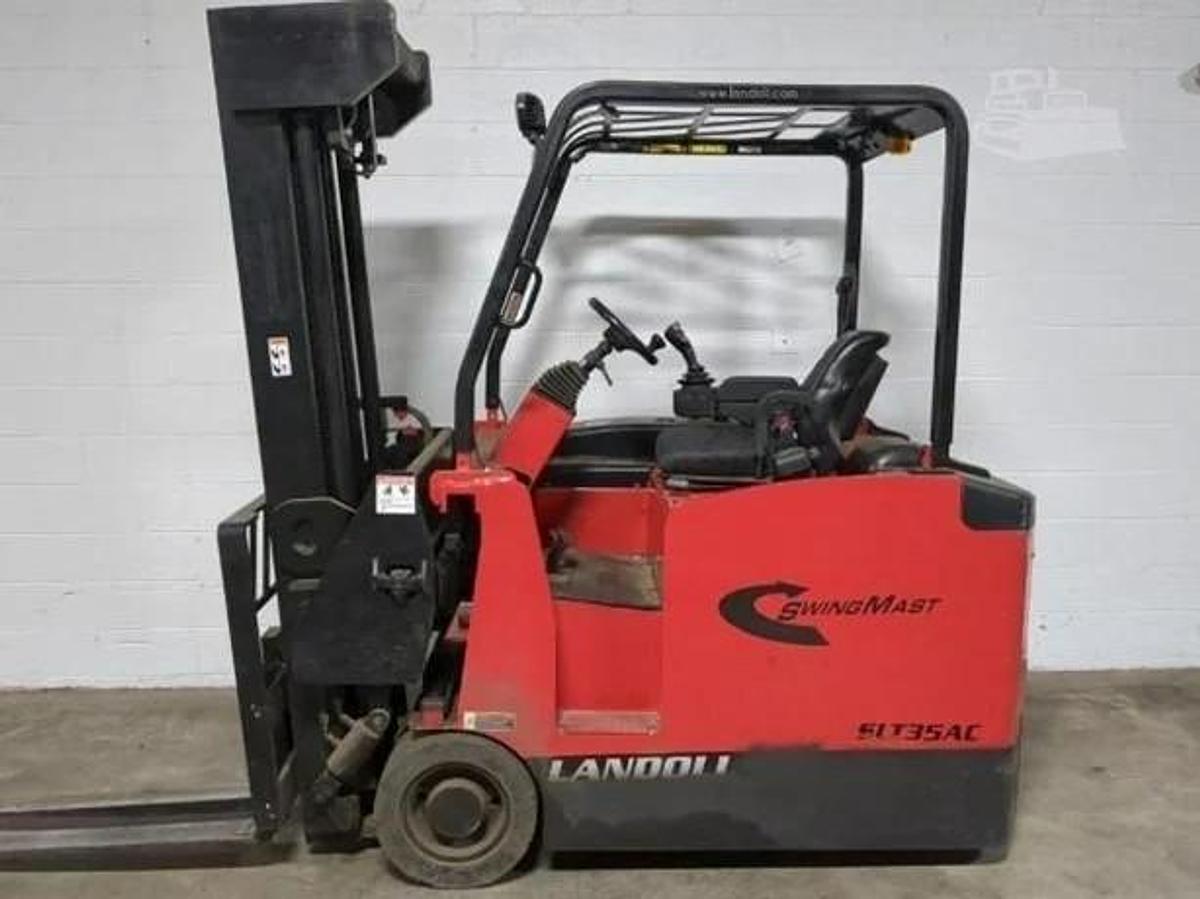 Opposite side view of Drexel SLT35AC showing multi-directional wheels, operator platform, and battery compartment – CSA certified VNA forklift