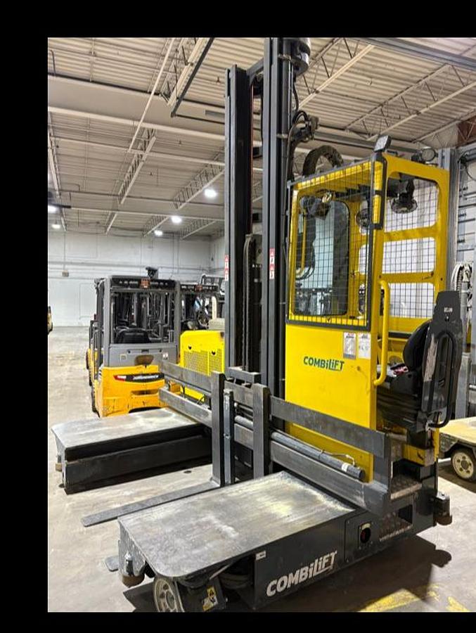 2021 Combilift C8000 side‑angle view with fork positioner, 48” forks, cushion tires, and 4‑directional steering