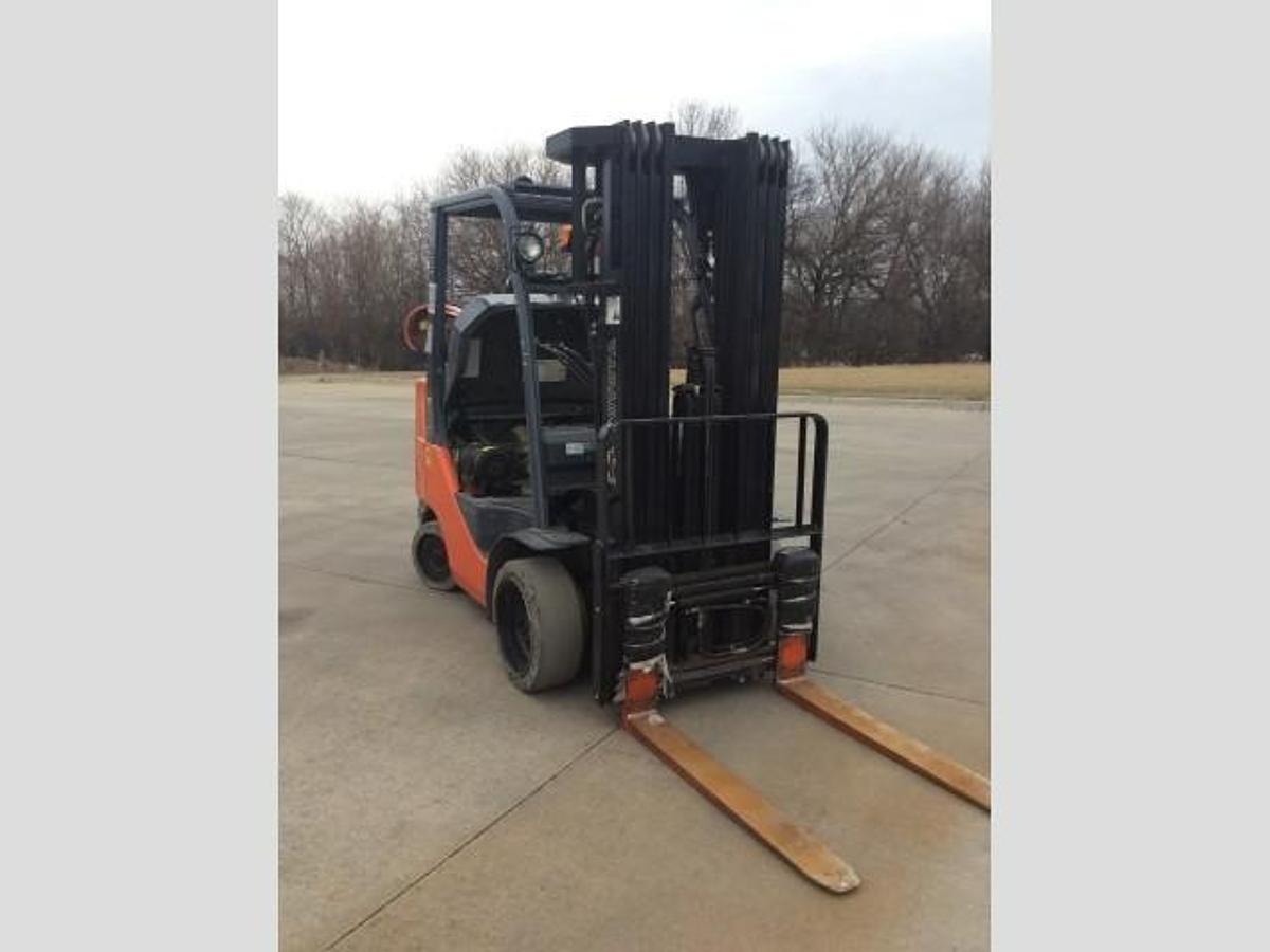 Opposite side view of refurbished 2014 Toyota 8FGCU30 LP gas forklift showing operator cab, rear chassis, and CSA decal during Brampton deployment