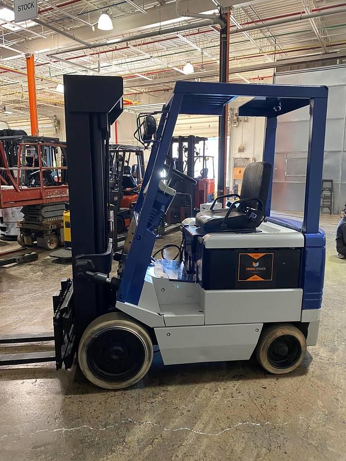 Opposite side view showing battery compartment and CSA-certified chassis