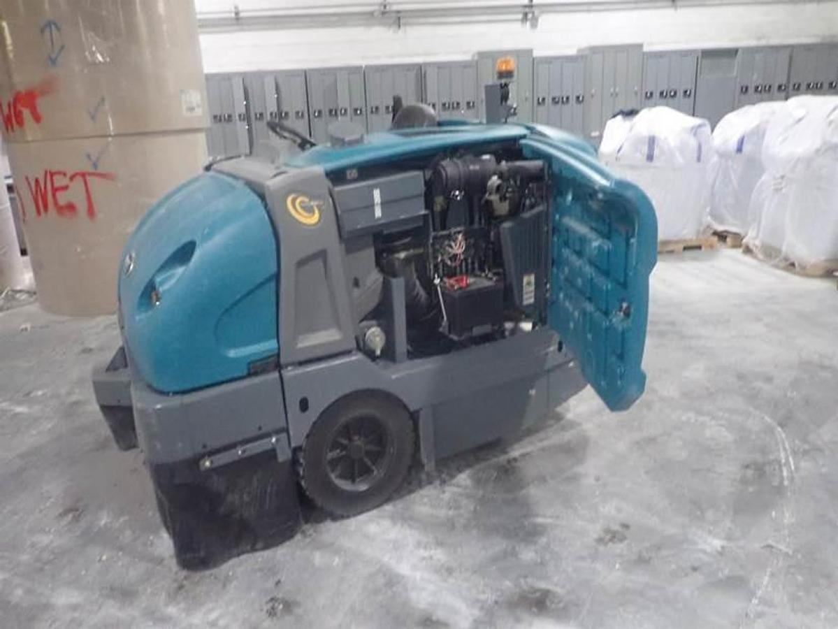 "2023 Tennant S30 LP rider sweeper side view with engine and service compartment open"