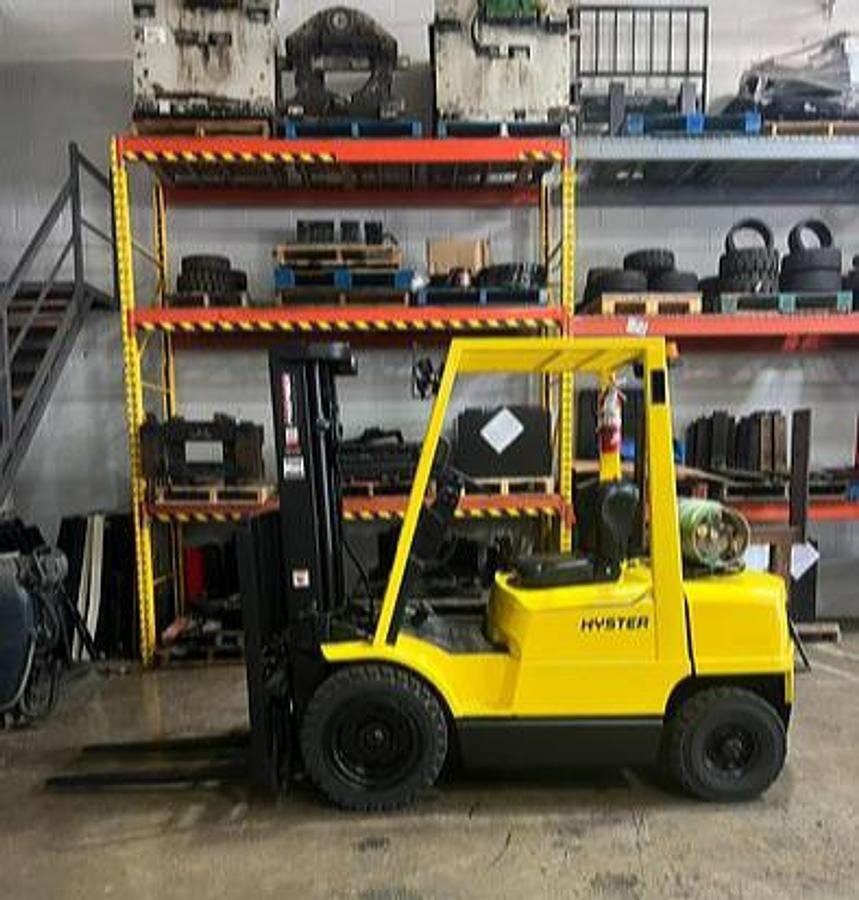 Budget Hyster H50XM forklift, older non‑CSA LPG pneumatic unit with 5,000 lb capacity.