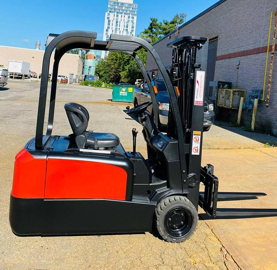 Side view of refurbished 2018 EP Equipment CPD20 3‑wheel electric forklift showing solid pneumatic tires, 3‑stage mast, and CSA certification decal during Brampton deployment.