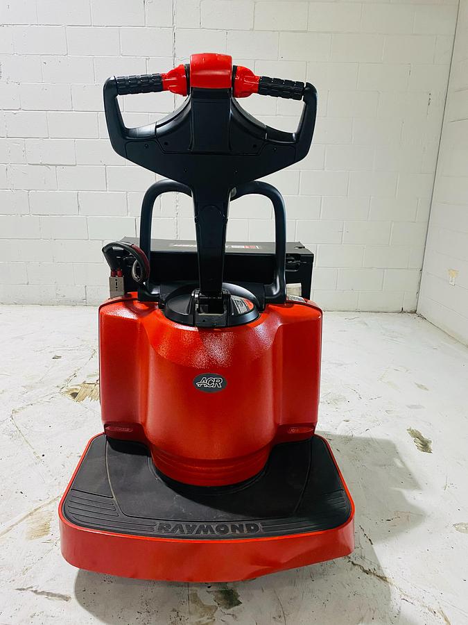 Rear view of Budget Raymond 8400 walkie pallet jack, older non‑CSA unit with tiller handle and rear chassis.