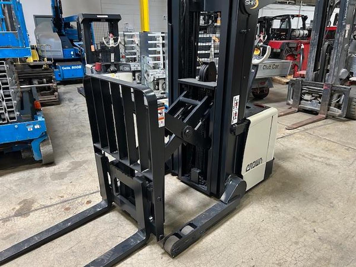 Crown SHR5540-35 – front angle view with forks extended – pantograph reach, side shift forks, and CSA safety decals – electric walkie reach stacker – Brampton ON
