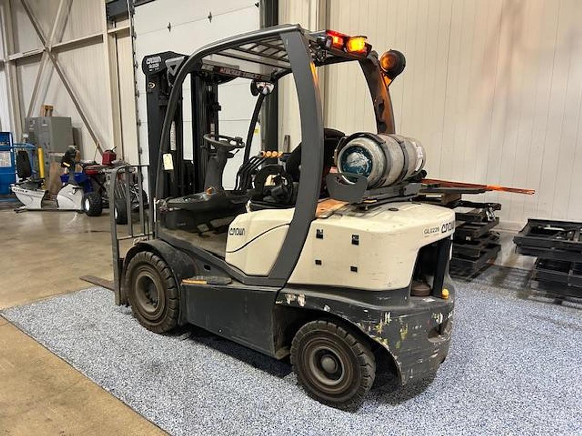 Rear side angle view of Crown C5-1050-50 propane forklift – CSA-certified 5,000 lb outdoor unit with full steel cab, 188” triple mast, and solid pneumatic tires – Premier Lift Equipment Brampton ON