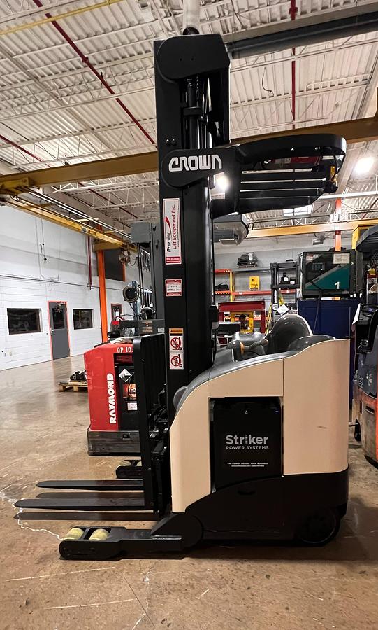 Side view of 2007 Crown RR55225‑45, 4,500 lb, 36V electric reach truck, 321" mast, CSA/MOL certified.