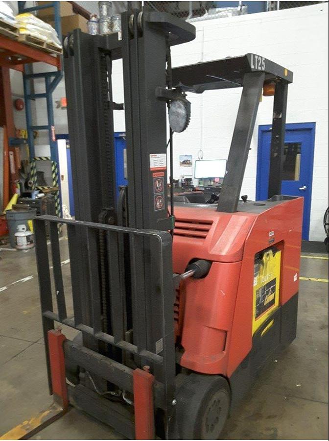 Front angle view of refurbished 2011 Raymond 425-C40TT electric dockstocker showing mast, forks, side shift carriage, and CSA inspection tag during Vaughan deployment