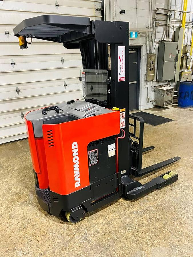 Rear side view of vintage 1996 Raymond EASIR40TT electric reach truck showing counterweight, rear chassis panel, and drive unit cover during Concord deployment