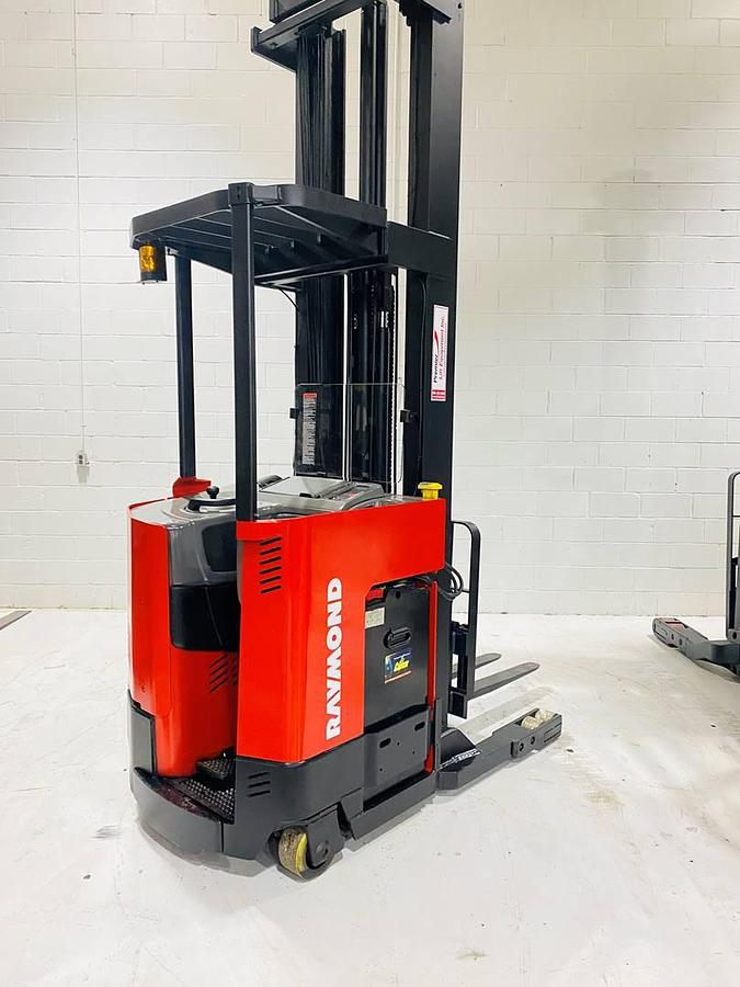 Alt="Rear side view of SOLD 2000 Raymond EASIR40TT electric reach truck highlighting freezer‑ready chassis and CSA certification decal"