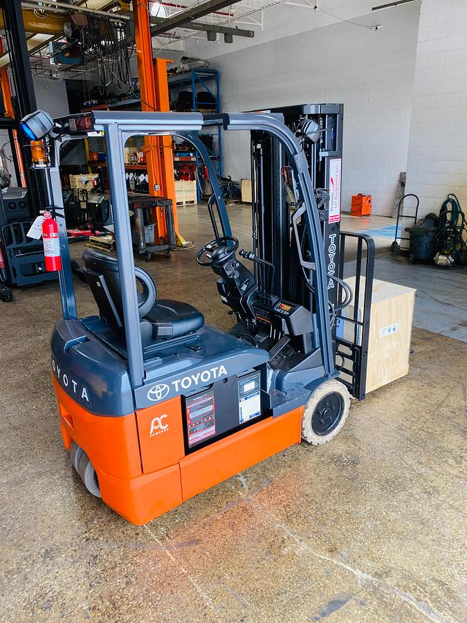 "2016 Toyota 8FBE15U electric forklift side angle view showing 3-wheel chassis and FSV mast"