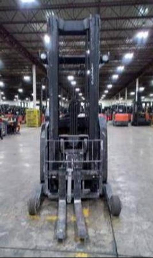 Side view of Yale NR045EBN electric reach truck – CSA-certified 4,500 lb single-reach forklift with 245” triple mast, oversized load wheels, and stand-up operator station staged in Brampton ON – Premier Lift Equipment