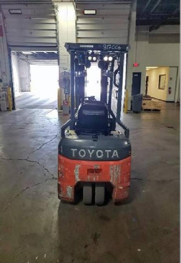 Rear view of Toyota 8FBE18U electric forklift highlighting counterweight, safety decals, and CSA certification during warehouse deployment