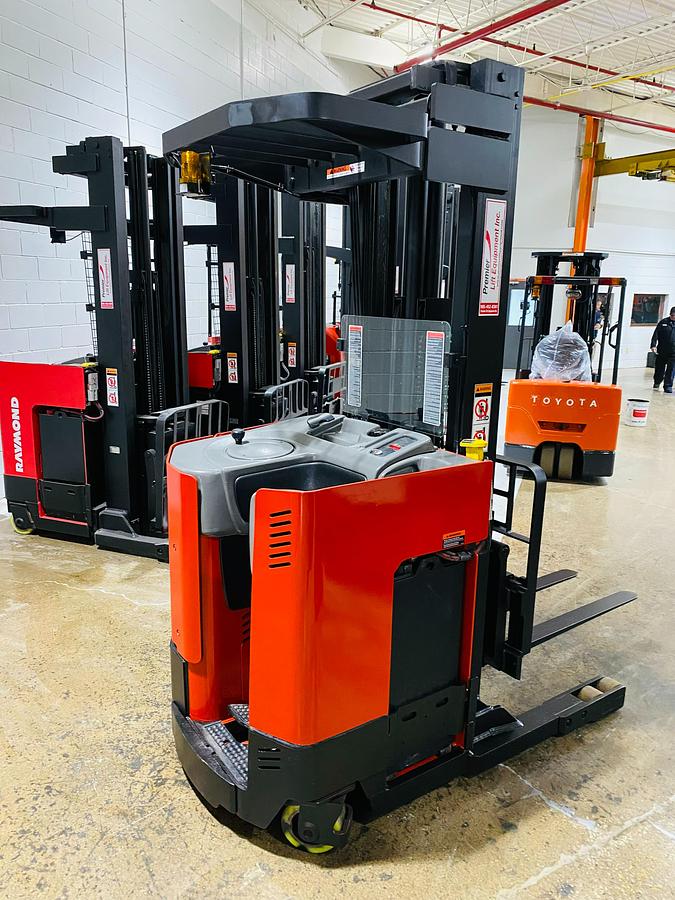 Refurbished 2013 Raymond EASIR30TT electric reach truck with CSA certification and new paint deployed in Mississauga for narrow aisle warehouse operations