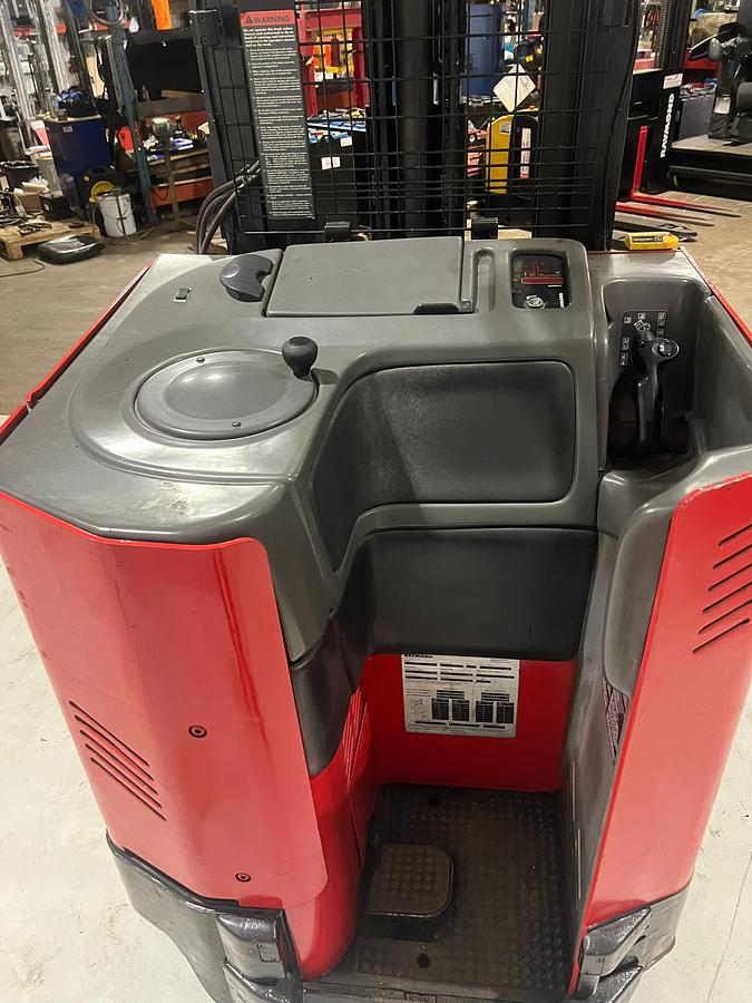 Operator compartment of Budget Raymond reach truck — controls, steering, and platform