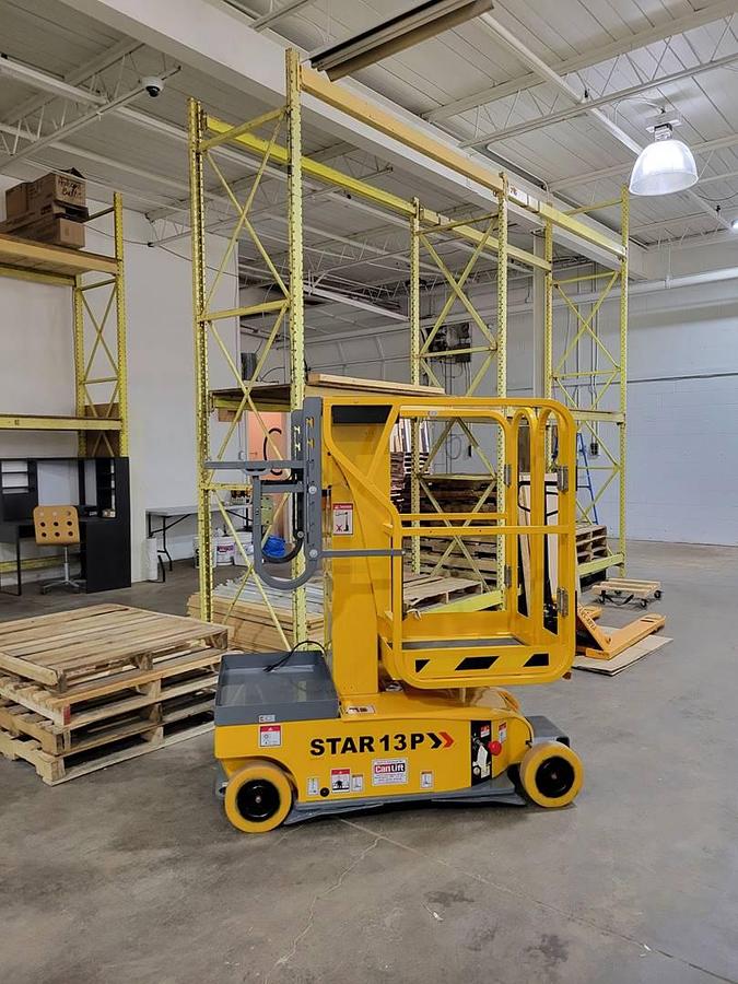 Side view of CSA-certified Haulotte STAR13P electric vertical mast lift with non-marking tires – staged in GTA ON