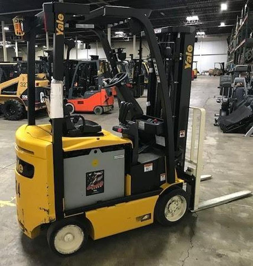 Side view of refurbished 2017 Yale ERC040VAN electric forklift showing short chassis, operator cab, and triple mast during Brampton deployment