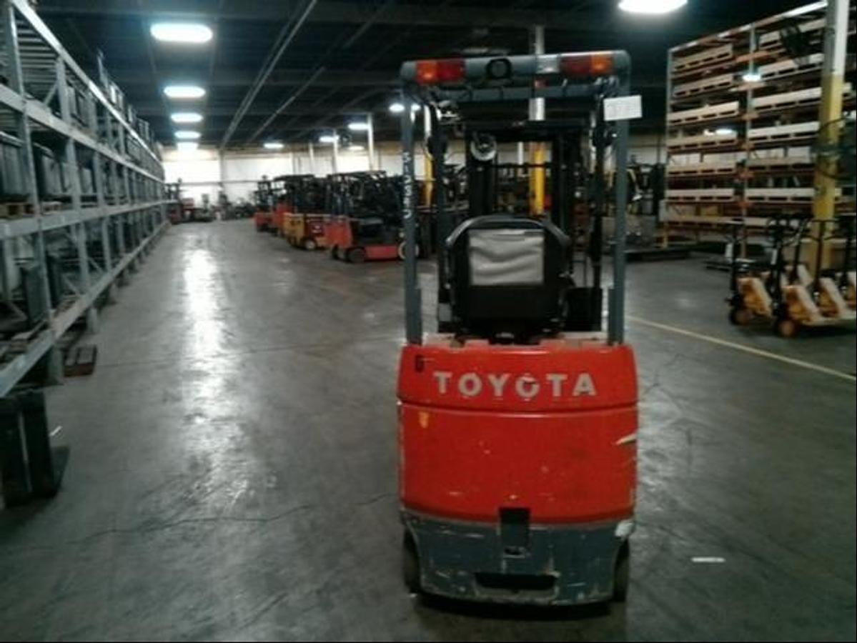 Back view of refurbished 2013 Toyota 7FBCU15 electric 4-wheel sit-down forklift showing counterweight, rear tires, and CSA certification decal during Ontario deployment