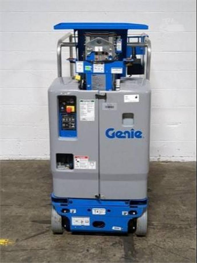 Genie GR-12 – rear view – battery compartment, charger port, rear wheels – compact vertical mast lift – Brampton ON