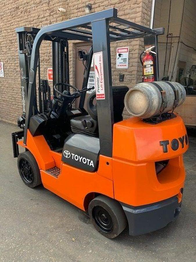 Rear side angle of refurbished 2006 Toyota 7FGCU25 LP gas forklift showing counterweight, rear chassis, and CSA decal during Brampton deployment