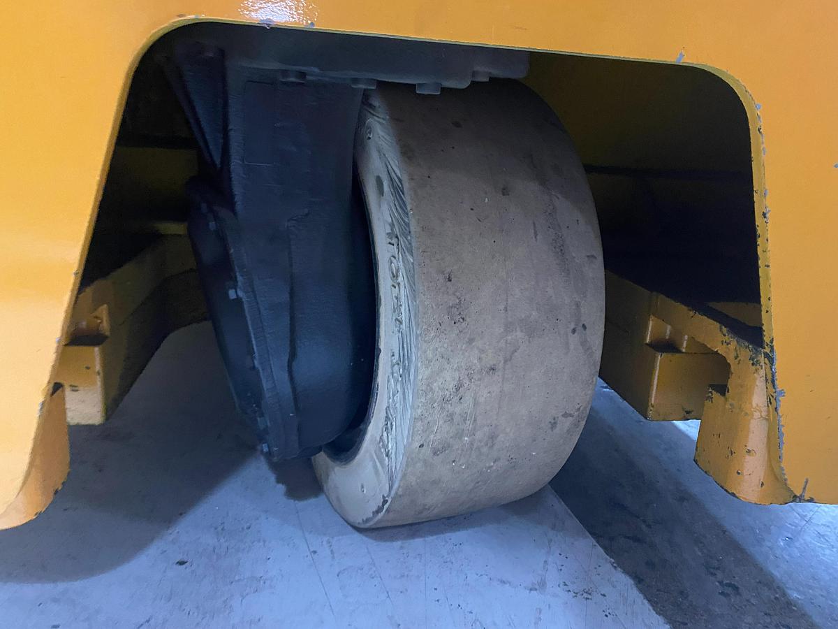 Rear non-marking poly tire on Drexel SLT30 electric swing mast forklift showing caster assembly and CSA indoor spec – unit staged in Brampton ON