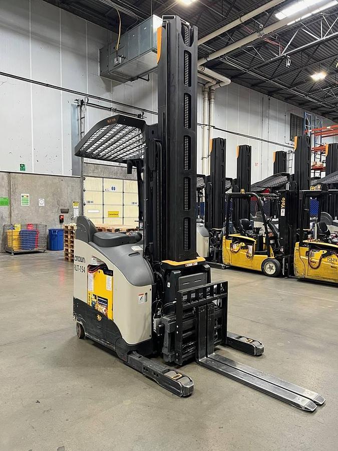 Front angled view of refurbished 2021 Crown RM6095S electric reach truck showing 42" B.L.O., 53" OBLO, 341" mast, 36 volt battery compartment, and CSA certification decal during Ontario deployment.